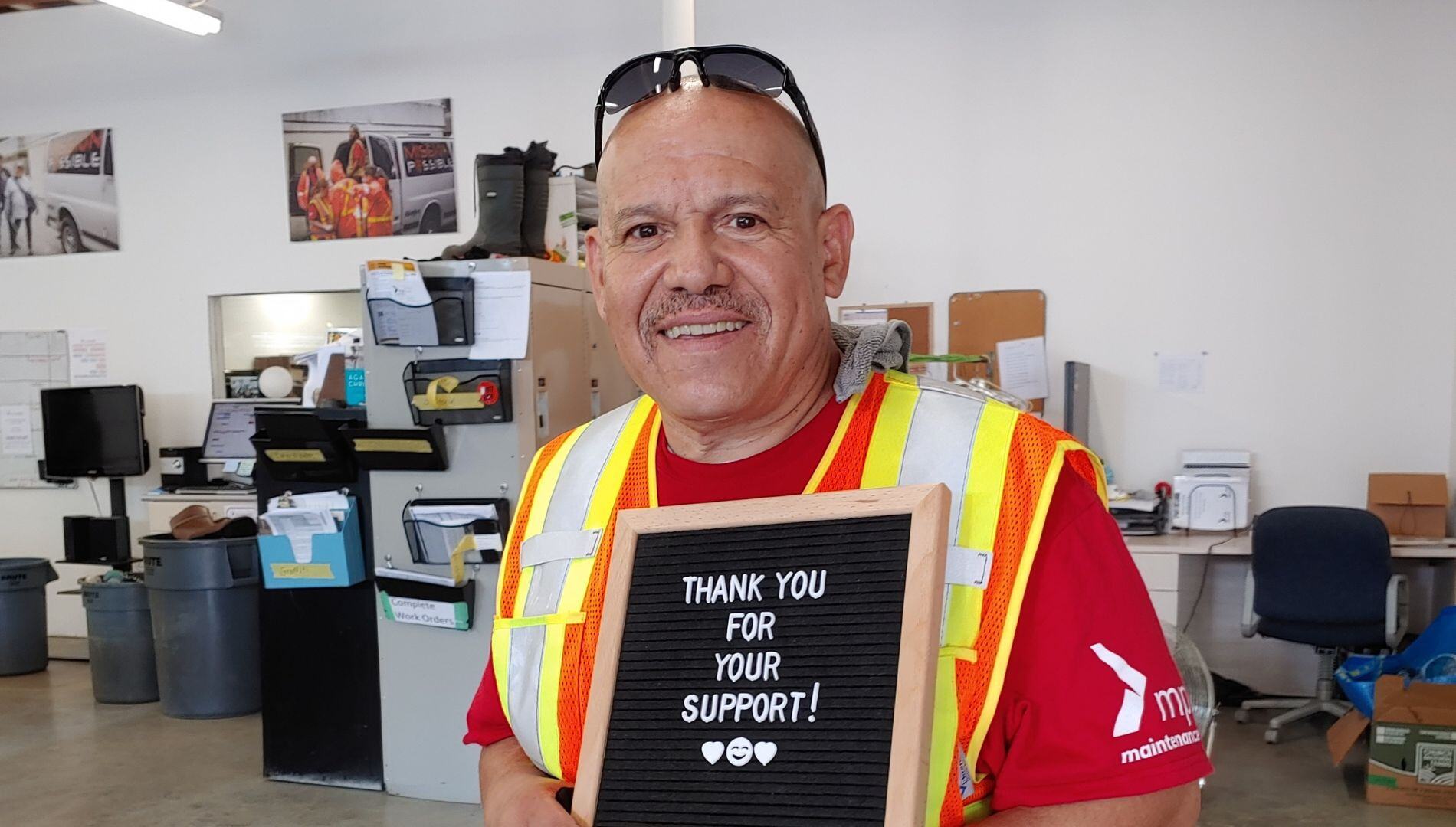 Diego with a Thank You For Your Support sign